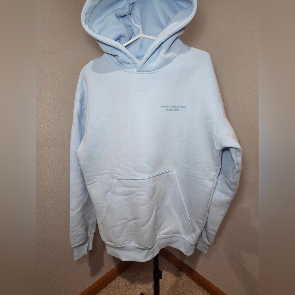 Comfrt Collections Pastel Edit Baby Blue Hoodie Size Small. New without Tags